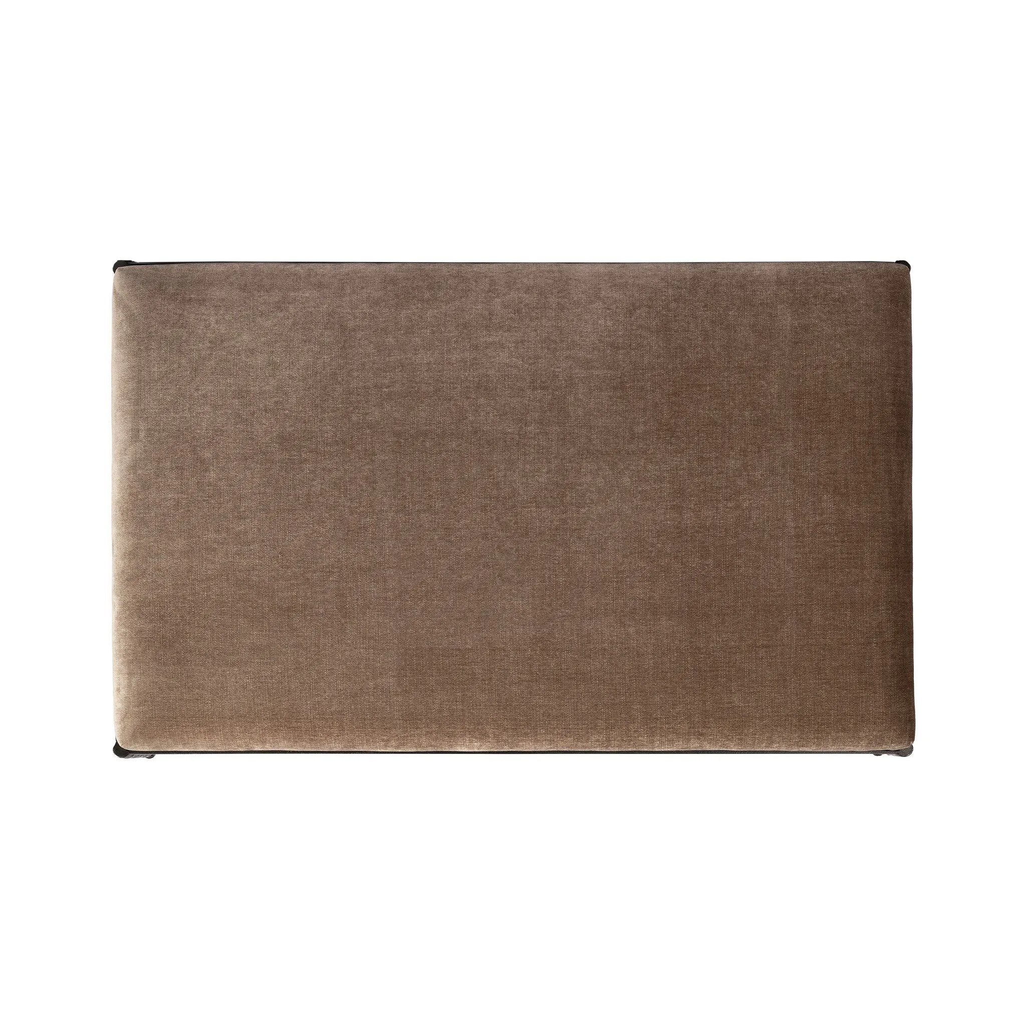 This French Industrialist-inspired cocktail ottoman features a curved stretcher base of bronzed hammered iron and a velvety seat in a versatile earth tone. Style with a sofa or sectional to create an extra surface in your living space, or for bonus seating. Amethyst Home provides interior design, new home construction design consulting, vintage area rugs, and lighting in the Seattle metro area.