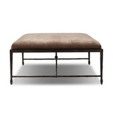 This French Industrialist-inspired cocktail ottoman features a curved stretcher base of bronzed hammered iron and a velvety seat in a versatile earth tone. Style with a sofa or sectional to create an extra surface in your living space, or for bonus seating. Amethyst Home provides interior design, new home construction design consulting, vintage area rugs, and lighting in the Winter Garden metro area.