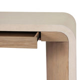 A thick layer of beige painted linen cascades this desk's soft waterfall shape in an eye-catching combination of texture. Crafted atop a mahogany and oak veneer base with rounded corners, this hardworking piece elevates the home-office workspace Amethyst Home provides interior design, new home construction design consulting, vintage area rugs, and lighting in the Monterey metro area.