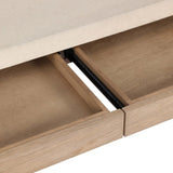 A thick layer of beige painted linen cascades this desk's soft waterfall shape in an eye-catching combination of texture. Crafted atop a mahogany and oak veneer base with rounded corners, this hardworking piece elevates the home-office workspace Amethyst Home provides interior design, new home construction design consulting, vintage area rugs, and lighting in the San Diego metro area.