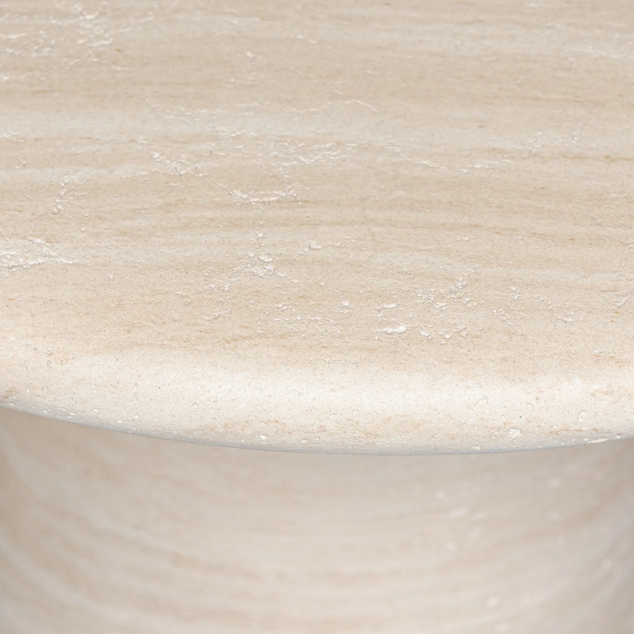 A dome-shaped pedestal base supports a rounded tabletop with bullnose edges. Made from cast concrete with a water-transfer finish which resemble natural stone Amethyst Home provides interior design, new home construction design consulting, vintage area rugs, and lighting in the Charlotte metro area.