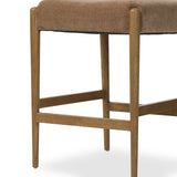 A fresh take on midcentury styling, perfectly sized for the counter. Supportive back and seat cushions are upholstered in a soft, neutral fabric and framed out by toasted solid oak Amethyst Home provides interior design, new home construction design consulting, vintage area rugs, and lighting in the Winter Garden metro area.