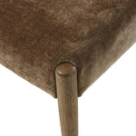 A midcentury-inspired piece brought to modern times. A supportive, sling-style back and seat cushion are upholstered in a soft, velvety fabric, with toasted oak armless framing Amethyst Home provides interior design, new home construction design consulting, vintage area rugs, and lighting in the Austin metro area.
