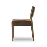 A midcentury-inspired piece brought to modern times. A supportive, sling-style back and seat cushion are upholstered in a soft, velvety fabric, with toasted oak armless framing Amethyst Home provides interior design, new home construction design consulting, vintage area rugs, and lighting in the Nashville metro area.