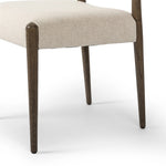 A midcentury-inspired piece, updated for modern times. A supportive back and seat cushion are upholstered in high-performance fabric, with a walnut-finished frame for a contrast of color. Steam regularly to keep fabric looking crisp. Amethyst Home provides interior design, new home construction design consulting, vintage area rugs, and lighting in the Austin metro area.