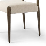 A midcentury-inspired piece, updated for modern times. A supportive back and seat cushion are upholstered in high-performance fabric, with a walnut-finished frame for a contrast of color. Steam regularly to keep fabric looking crisp. Amethyst Home provides interior design, new home construction design consulting, vintage area rugs, and lighting in the Austin metro area.