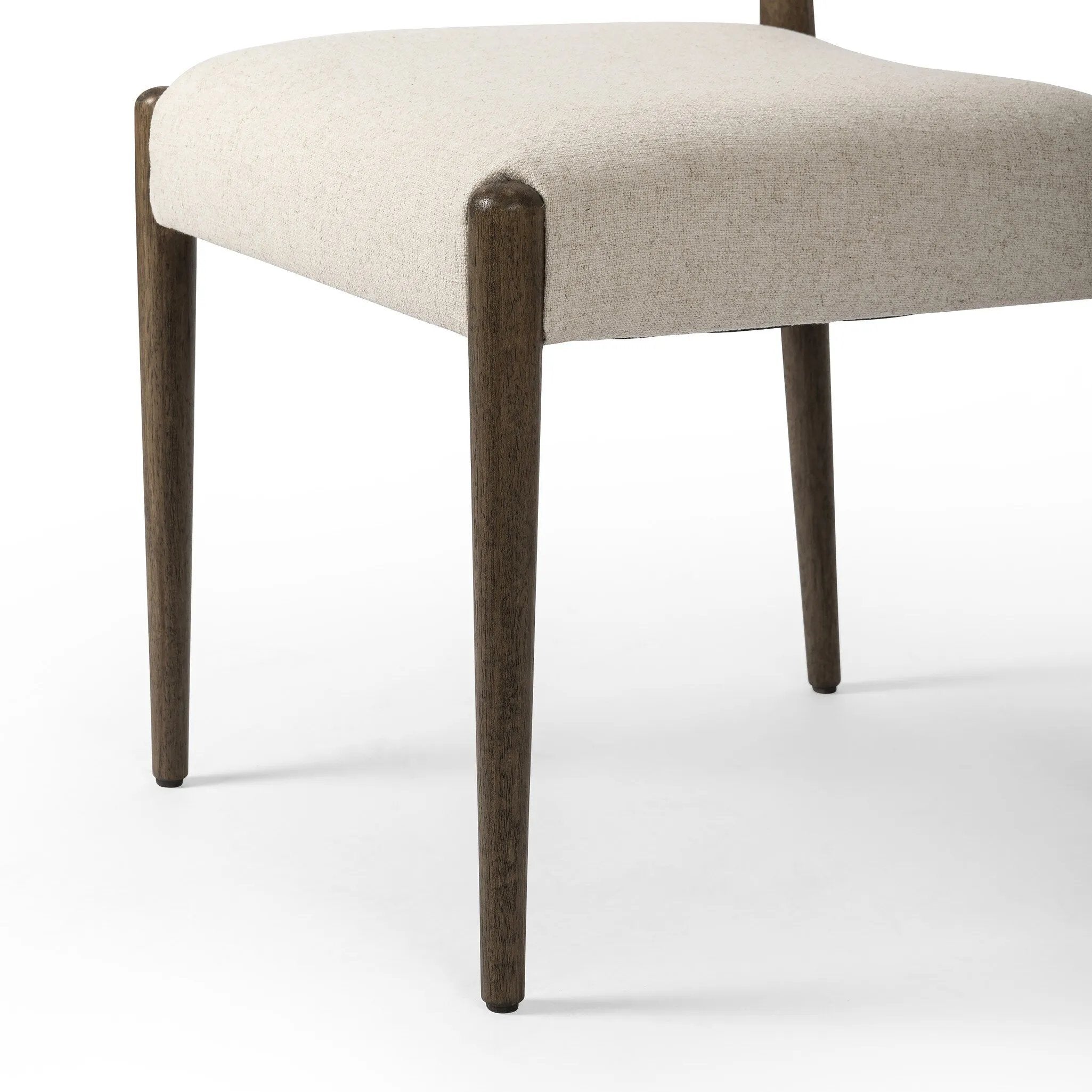 A midcentury-inspired piece, updated for modern times. A supportive back and seat cushion are upholstered in high-performance fabric, with a walnut-finished frame for a contrast of color. Steam regularly to keep fabric looking crisp. Amethyst Home provides interior design, new home construction design consulting, vintage area rugs, and lighting in the Newport Beach metro area.