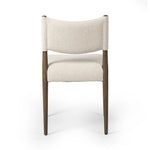 A midcentury-inspired piece, updated for modern times. A supportive back and seat cushion are upholstered in high-performance fabric, with a walnut-finished frame for a contrast of color. Steam regularly to keep fabric looking crisp. Amethyst Home provides interior design, new home construction design consulting, vintage area rugs, and lighting in the Washington metro area.