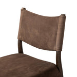 A midcentury-inspired piece brought to modern times. A supportive, sling-style back and seat cushion are upholstered in a soft, velvety fabric, with toasted oak armless framing Amethyst Home provides interior design, new home construction design consulting, vintage area rugs, and lighting in the Alpharetta metro area.