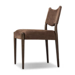 A midcentury-inspired piece brought to modern times. A supportive, sling-style back and seat cushion are upholstered in a soft, velvety fabric, with toasted oak armless framing Amethyst Home provides interior design, new home construction design consulting, vintage area rugs, and lighting in the Austin metro area.