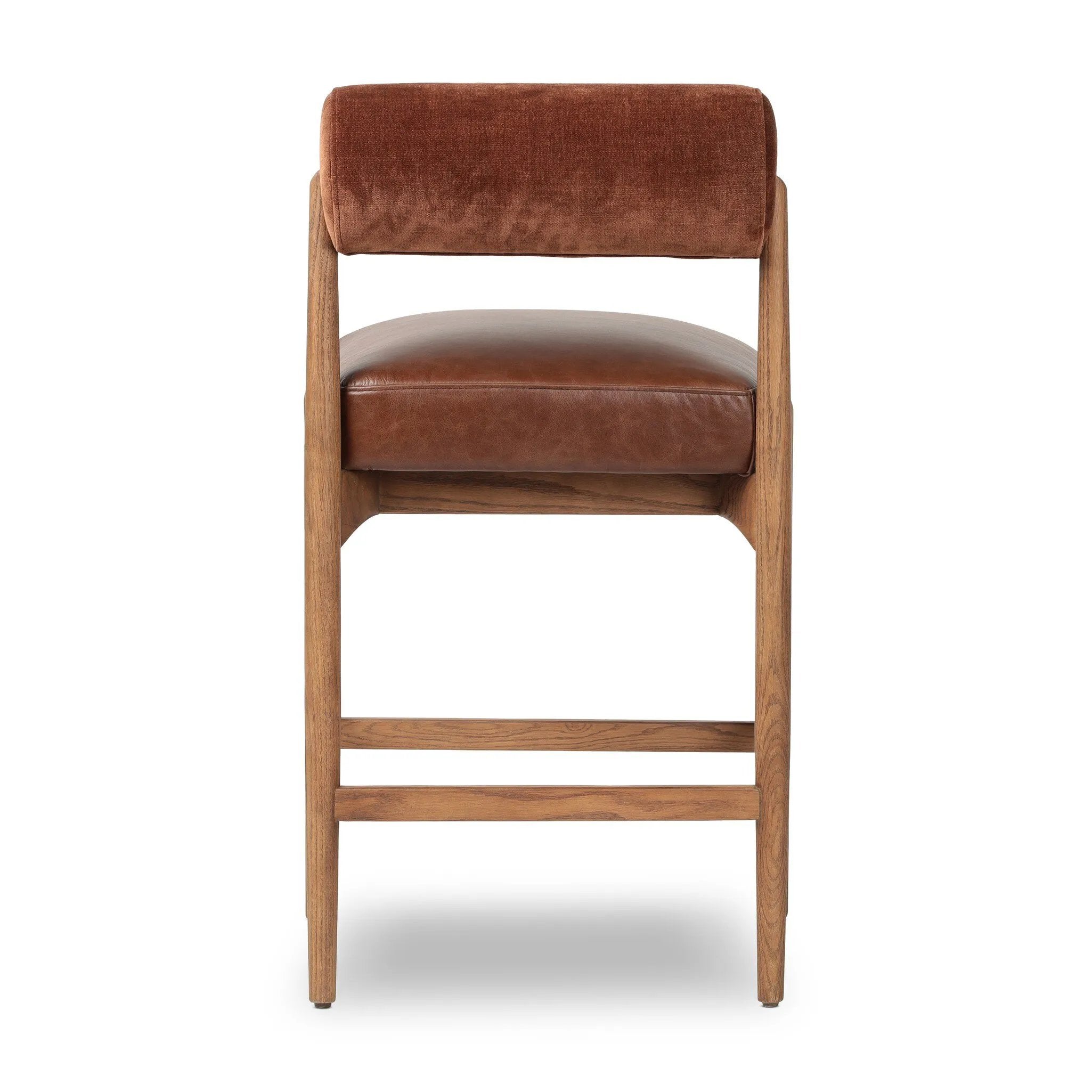 Featuring Jazelle Altair Sienna Counter Stool by Four Hands at Amethyst Home. The classic counter stool gets a playful update with a bolstered cylinder seat back. Made from top-grain leather and warm-finished oak to elevate your bar, kitchen or dining space. Overall Dimensions: 22.25"w x 25.75"d x 36.50"h. Amethyst Home provides interior design, new home construction design consulting, vintage area rugs, and lighting in the Charlotte metro area.