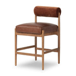 Featuring Jazelle Altair Sienna Counter Stool by Four Hands at Amethyst Home. The classic counter stool gets a playful update with a bolstered cylinder seat back. Made from top-grain leather and warm-finished oak to elevate your bar, kitchen or dining space. Overall Dimensions: 22.25"w x 25.75"d x 36.50"h. Amethyst Home provides interior design, new home construction design consulting, vintage area rugs, and lighting in the Laguna Beach metro area.