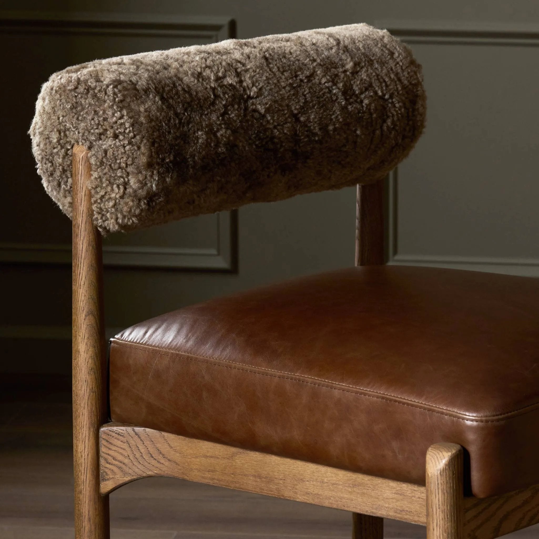Featuring Jazelle Taupe Shearling Counter Stool by Four Hands at Amethyst Home. Bring mixed materials to the counter. Solid oak, top-grain leather and soft shearling fuse for a playful update to midcentury and Seventies styling. Overall Dimensions: 22.25"w x 25.75"d x 36.50"h. Amethyst Home provides interior design, new home construction design consulting, vintage area rugs, and lighting in the Laguna Beach metro area.