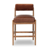 Featuring Jazelle Altair Sienna Counter Stool by Four Hands at Amethyst Home. The classic counter stool gets a playful update with a bolstered cylinder seat back. Made from top-grain leather and warm-finished oak to elevate your bar, kitchen or dining space. Overall Dimensions: 22.25"w x 25.75"d x 36.50"h. Amethyst Home provides interior design, new home construction design consulting, vintage area rugs, and lighting in the Seattle metro area.