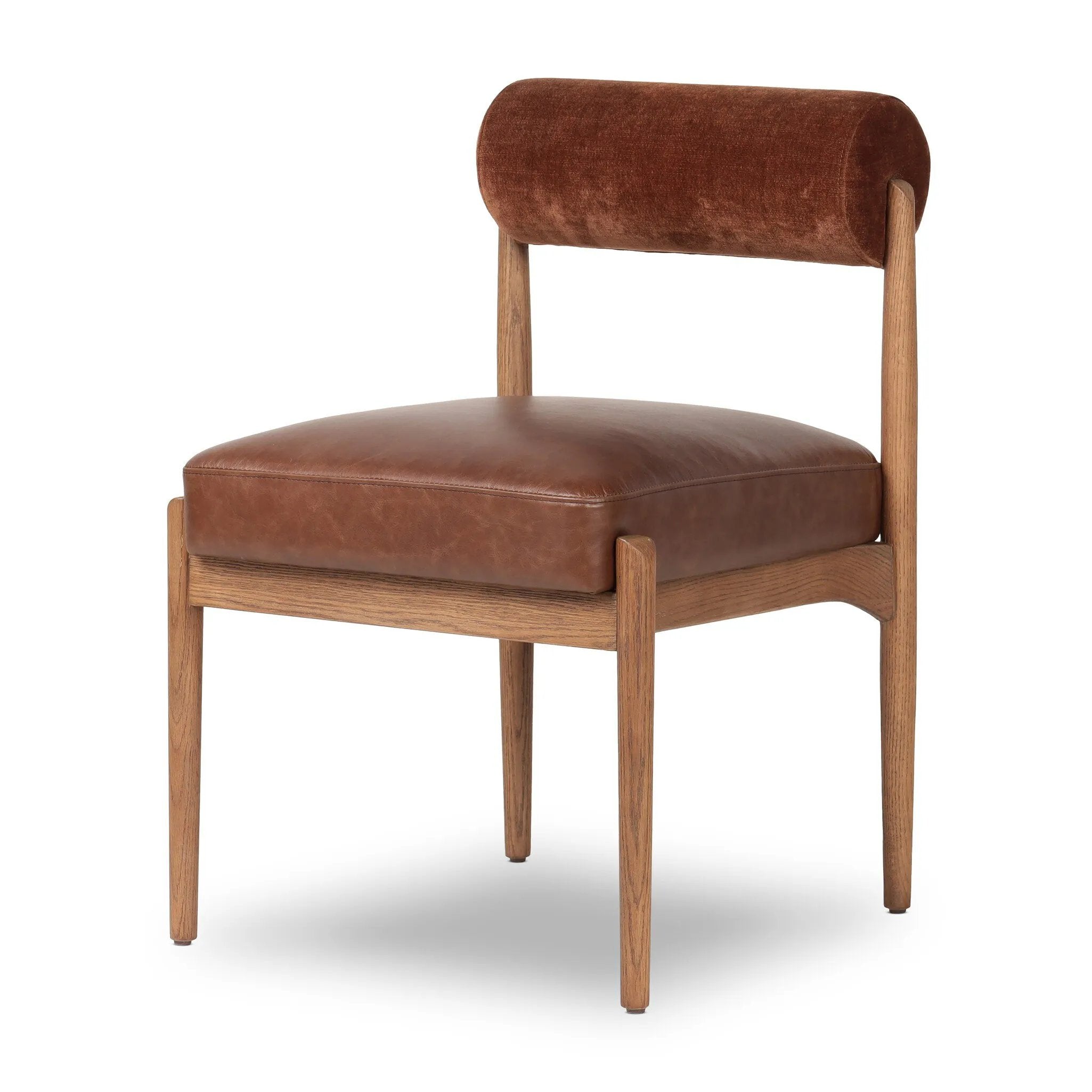Featuring Jazelle Altair Sienna Dining Chair by Four Hands at Amethyst Home. The armless dining chair gets a playful update with a bolstered cylinder seat back. Made from top-grain leather and warm-finished oak to elevate your bar, kitchen or dining space. Overall Dimensions: 22.25"w x 25.75"d x 32.25"h. Amethyst Home provides interior design, new home construction design consulting, vintage area rugs, and lighting in the San Diego metro area.