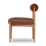 Featuring Jazelle Altair Sienna Dining Chair by Four Hands at Amethyst Home. The armless dining chair gets a playful update with a bolstered cylinder seat back. Made from top-grain leather and warm-finished oak to elevate your bar, kitchen or dining space. Overall Dimensions: 22.25"w x 25.75"d x 32.25"h. Amethyst Home provides interior design, new home construction design consulting, vintage area rugs, and lighting in the Tampa metro area.