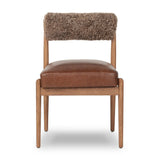 Featuring Jazelle Taupe Shearling Dining Chair by Four Hands at Amethyst Home. The armless dining chair gets a playful update with mixed materials and a bolstered cylinder seat back. Inspired by midcentury and Seventies styling and made from solid oak, top-grain leather  and soft shearling to elevate your bar, kitchen or dining space. Overall Dimensions. Amethyst Home provides interior design, new home construction design consulting, vintage area rugs, and lighting in the Winter Garden metro area.