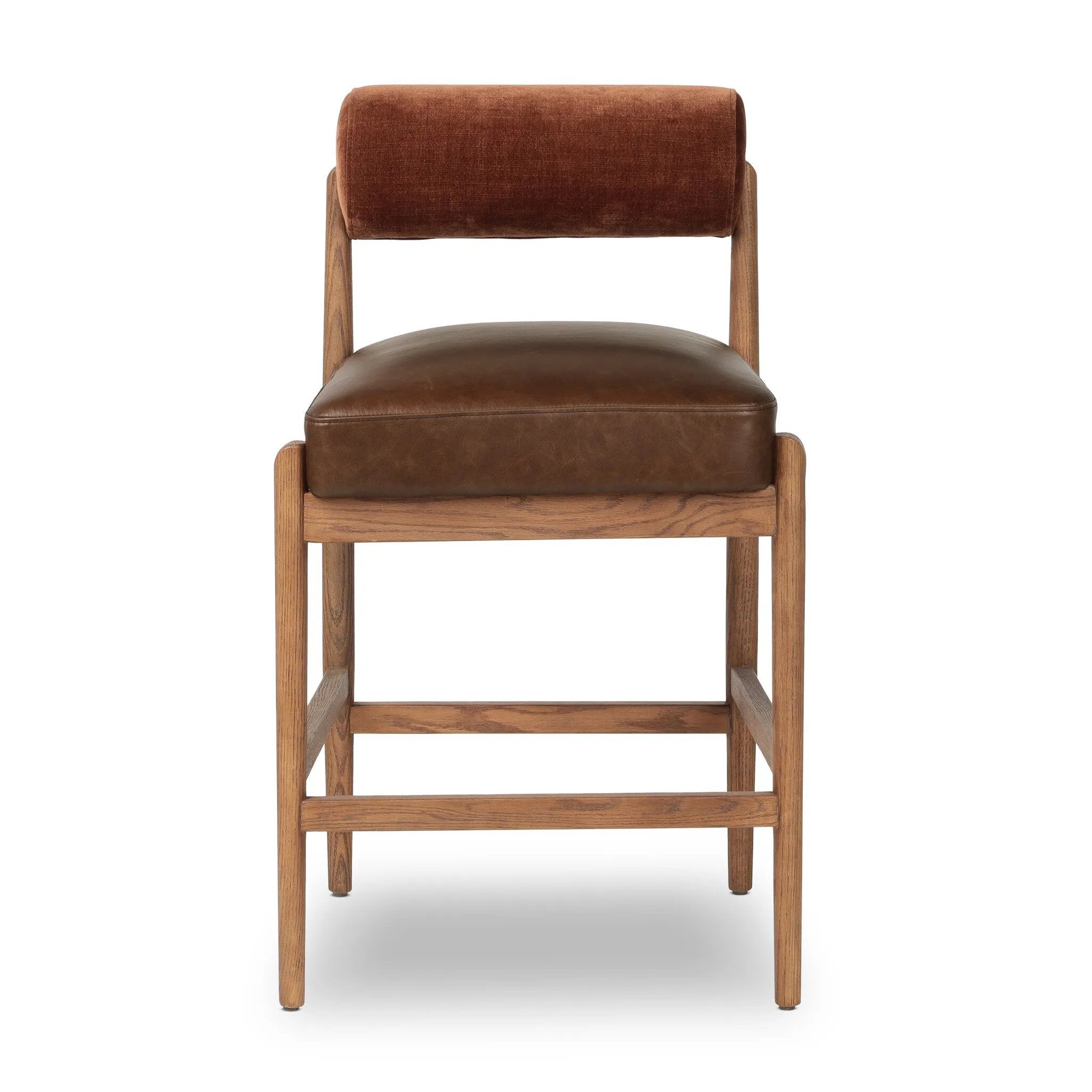 The classic counter stool gets a playful update with a bolstered cylinder seat back. Made from top-grain leather, velvet-like upholstery and warm-finished oak to elevate your bar, kitchen or dining space Amethyst Home provides interior design, new home construction design consulting, vintage area rugs, and lighting in the Alpharetta metro area.