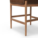 The classic counter stool gets a playful update with a bolstered cylinder seat back. Made from top-grain leather, velvet-like upholstery and warm-finished oak to elevate your bar, kitchen or dining space Amethyst Home provides interior design, new home construction design consulting, vintage area rugs, and lighting in the Boston metro area.