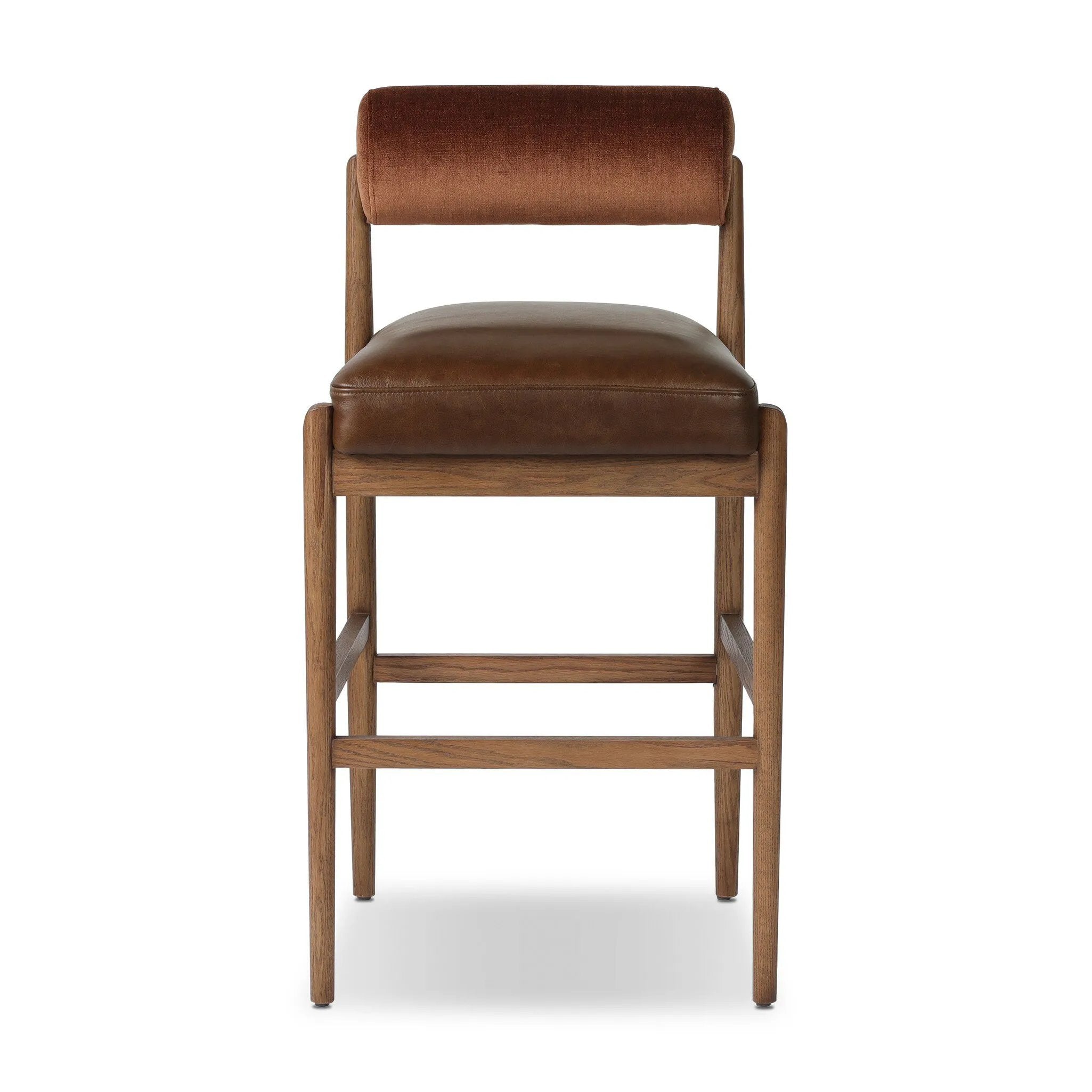 The classic counter stool gets a playful update with a bolstered cylinder seat back. Made from top-grain leather, velvet-like upholstery and warm-finished oak to elevate your bar, kitchen or dining space Amethyst Home provides interior design, new home construction design consulting, vintage area rugs, and lighting in the Dallas metro area.
