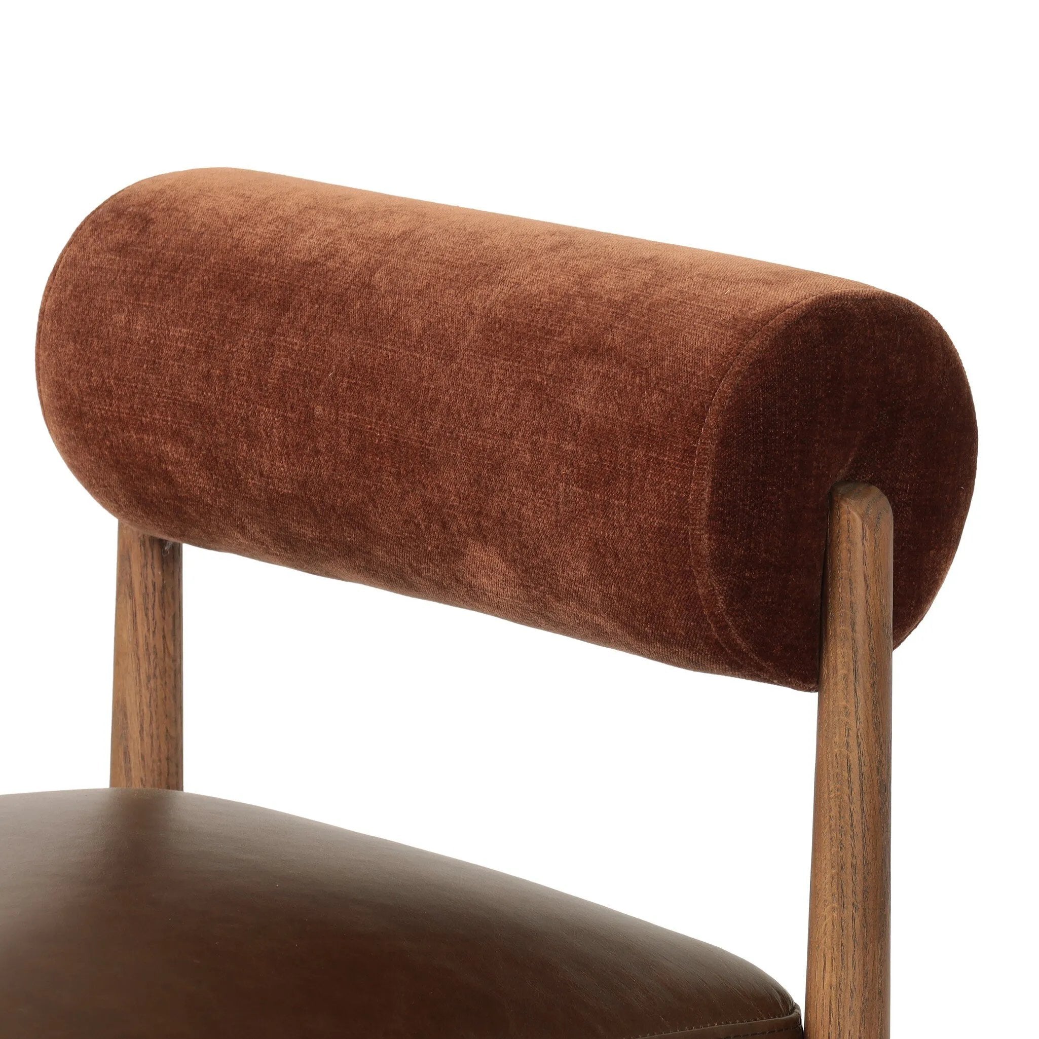 The classic counter stool gets a playful update with a bolstered cylinder seat back. Made from top-grain leather, velvet-like upholstery and warm-finished oak to elevate your bar, kitchen or dining space Amethyst Home provides interior design, new home construction design consulting, vintage area rugs, and lighting in the Des Moines metro area.