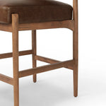 The classic counter stool gets a playful update with a bolstered cylinder seat back. Made from top-grain leather, velvet-like upholstery and warm-finished oak to elevate your bar, kitchen or dining space Amethyst Home provides interior design, new home construction design consulting, vintage area rugs, and lighting in the Houston metro area.