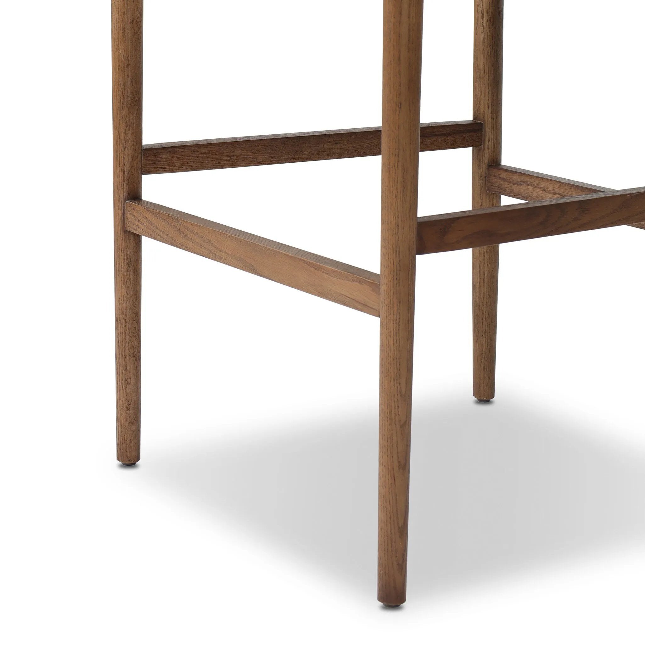 The classic counter stool gets a playful update with a bolstered cylinder seat back. Made from top-grain leather, velvet-like upholstery and warm-finished oak to elevate your bar, kitchen or dining space Amethyst Home provides interior design, new home construction design consulting, vintage area rugs, and lighting in the Laguna Beach metro area.