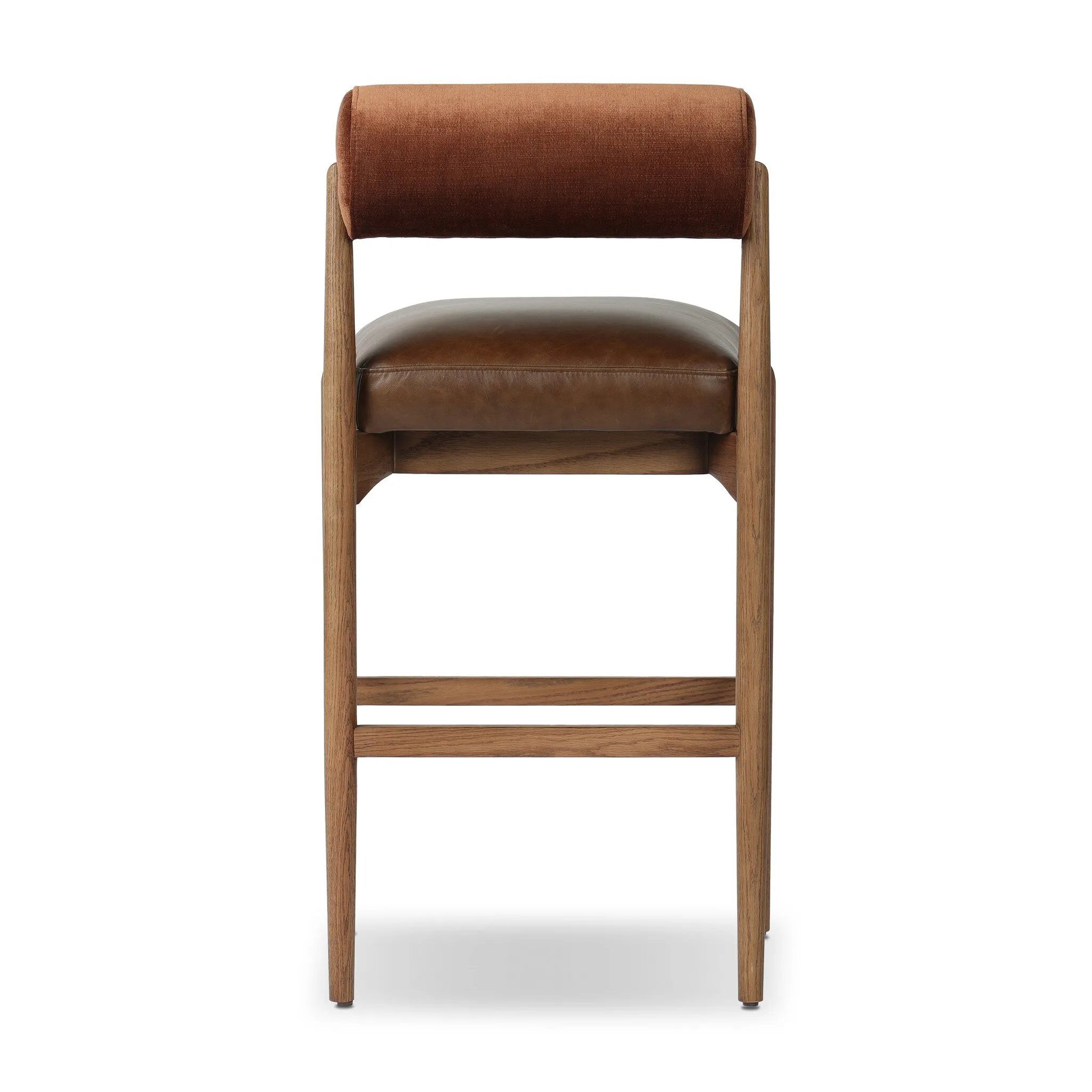 The classic counter stool gets a playful update with a bolstered cylinder seat back. Made from top-grain leather, velvet-like upholstery and warm-finished oak to elevate your bar, kitchen or dining space Amethyst Home provides interior design, new home construction design consulting, vintage area rugs, and lighting in the Monterey metro area.