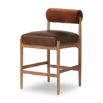 The classic counter stool gets a playful update with a bolstered cylinder seat back. Made from top-grain leather, velvet-like upholstery and warm-finished oak to elevate your bar, kitchen or dining space Amethyst Home provides interior design, new home construction design consulting, vintage area rugs, and lighting in the Portland metro area.