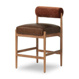 The classic counter stool gets a playful update with a bolstered cylinder seat back. Made from top-grain leather, velvet-like upholstery and warm-finished oak to elevate your bar, kitchen or dining space Amethyst Home provides interior design, new home construction design consulting, vintage area rugs, and lighting in the Portland metro area.