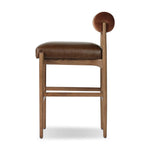 The classic counter stool gets a playful update with a bolstered cylinder seat back. Made from top-grain leather, velvet-like upholstery and warm-finished oak to elevate your bar, kitchen or dining space Amethyst Home provides interior design, new home construction design consulting, vintage area rugs, and lighting in the Seattle metro area.
