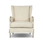 Bridging timeless tradition with modern edge, this upholstered chair strikes a one-of-a-kind silhouette. Its fixed, skirted slipcover and subtle winged back offer a classic feel, while a unique metal arm reveal  and slightly flared legs create an unparalleled look. Amethyst Home provides interior design, new home construction design consulting, vintage area rugs, and lighting in the Miami metro area.