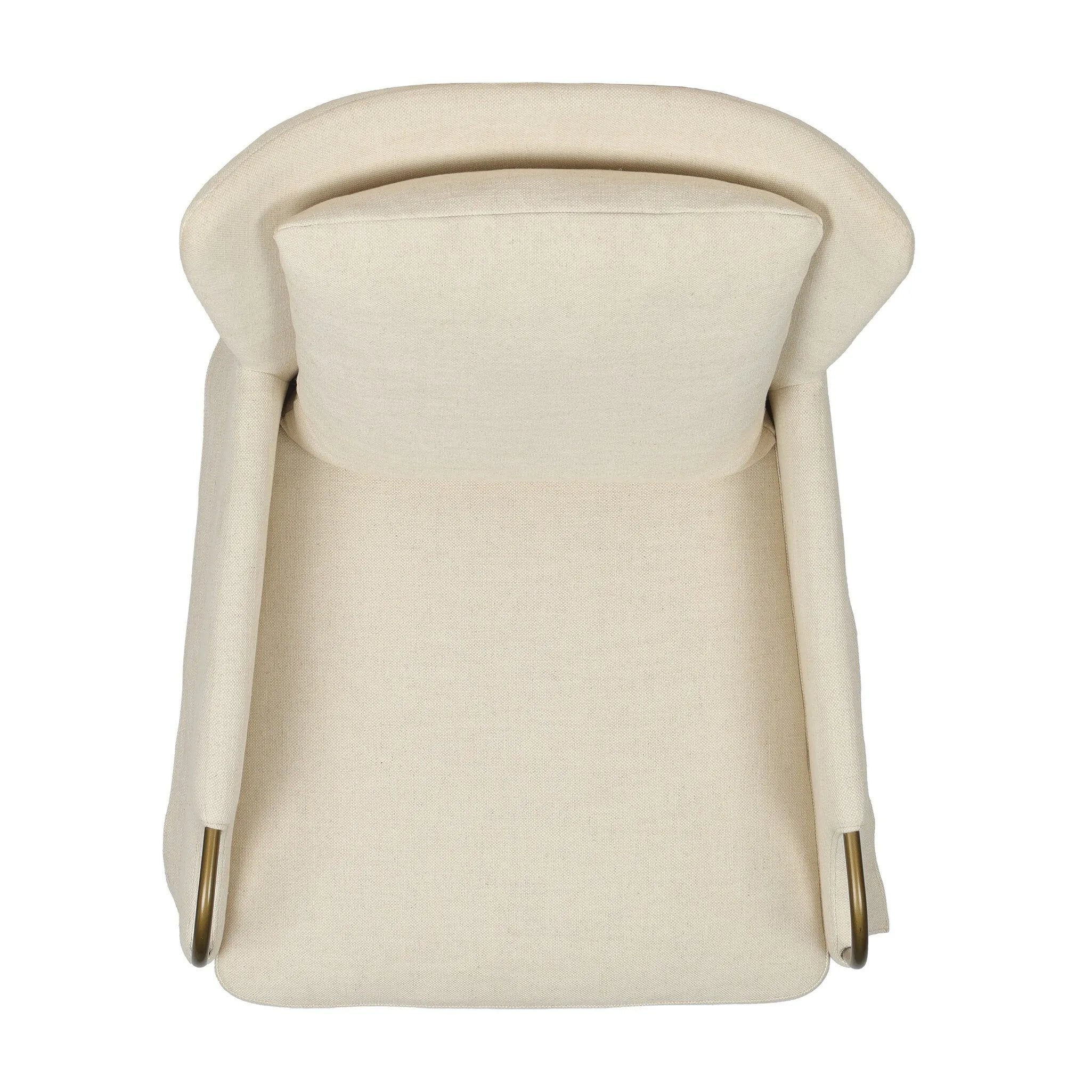 Bridging timeless tradition with modern edge, this upholstered chair strikes a one-of-a-kind silhouette. Its fixed, skirted slipcover and subtle winged back offer a classic feel, while a unique metal arm reveal  and slightly flared legs create an unparalleled look. Amethyst Home provides interior design, new home construction design consulting, vintage area rugs, and lighting in the Newport Beach metro area.
