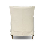 Bridging timeless tradition with modern edge, this upholstered chair strikes a one-of-a-kind silhouette. Its fixed, skirted slipcover and subtle winged back offer a classic feel, while a unique metal arm reveal  and slightly flared legs create an unparalleled look. Amethyst Home provides interior design, new home construction design consulting, vintage area rugs, and lighting in the Scottsdale metro area.