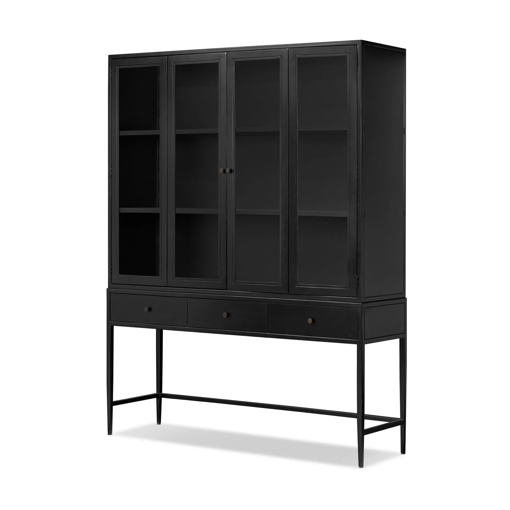 Storage-driven cabinetry inspired by angular geometry. Rich with monochromatic presence, a black-finished metal cabinet pairs with an airy iron base for a balance in scale. Three drawers bring even more storage, with bi-fold glass doors for display options. Minimalist bronzed hardware completes the look Amethyst Home provides interior design, new home construction design consulting, vintage area rugs, and lighting in the Winter Garden metro area.