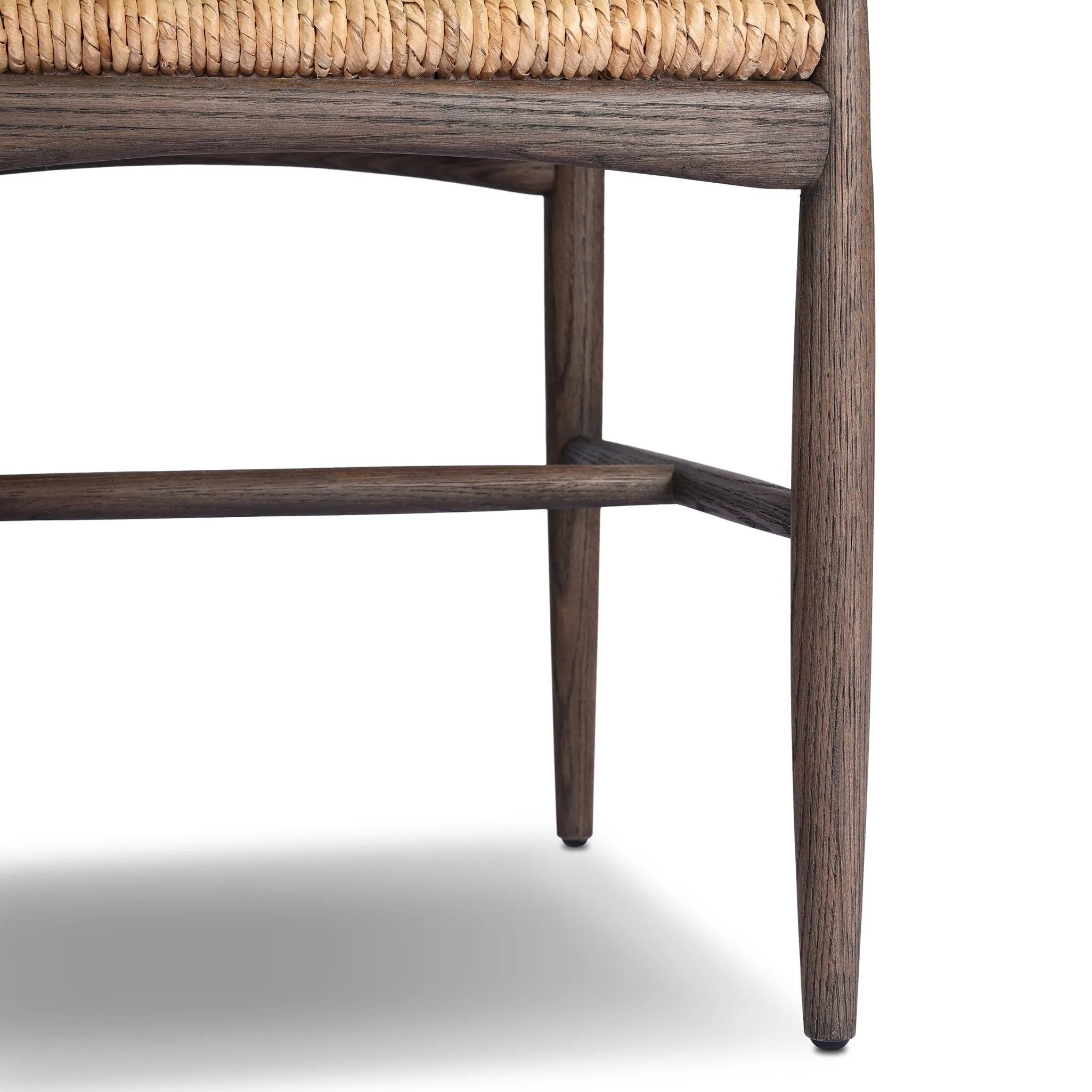 Featuring Jovan Savile Flax Dining Chair With Cushion by Four Hands at Amethyst Home. A seamless addition to your dining collection, a slim-profile dining chair pairs a woven banana leaf seat with a solid oak frame featuring a bentwood back. A tie-fasten seat cushion of high-performance fabric completes the look. Performance fabrics are specially created . Amethyst Home provides interior design, new home construction design consulting, vintage area rugs, and lighting in the Los Angeles metro area.