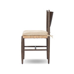 Featuring Jovan Savile Flax Dining Chair With Cushion by Four Hands at Amethyst Home. A seamless addition to your dining collection, a slim-profile dining chair pairs a woven banana leaf seat with a solid oak frame featuring a bentwood back. A tie-fasten seat cushion of high-performance fabric completes the look. Performance fabrics are specially create. Amethyst Home provides interior design, new home construction design consulting, vintage area rugs, and lighting in the Newport Beach metro area.