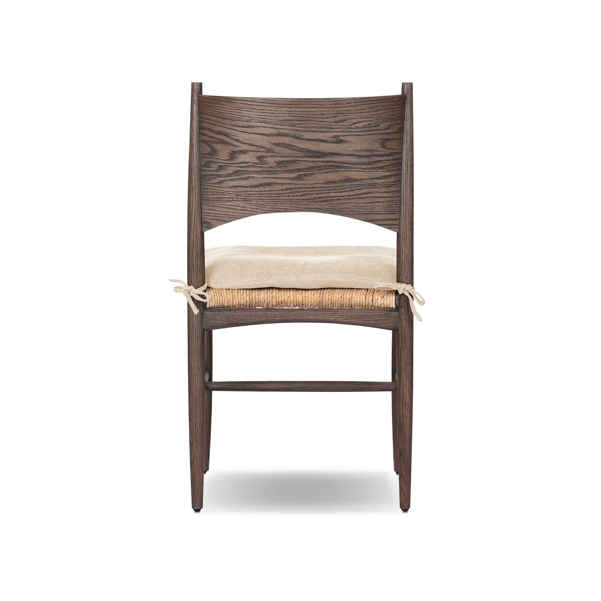 Featuring Jovan Savile Flax Dining Chair With Cushion by Four Hands at Amethyst Home. A seamless addition to your dining collection, a slim-profile dining chair pairs a woven banana leaf seat with a solid oak frame featuring a bentwood back. A tie-fasten seat cushion of high-performance fabric completes the look. Performance fabrics are specially created to wit. Amethyst Home provides interior design, new home construction design consulting, vintage area rugs, and lighting in the Omaha metro area.