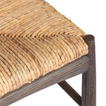 A seamless addition to your dining collection, a slim-profile dining chair pairs a woven banana leaf seat with a solid oak frame featuring a bentwood back Amethyst Home provides interior design, new home construction design consulting, vintage area rugs, and lighting in the Houston metro area.