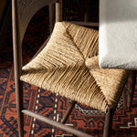 A seamless addition to your dining collection, a slim-profile dining chair pairs a woven banana leaf seat with a solid oak frame featuring a bentwood back Amethyst Home provides interior design, new home construction design consulting, vintage area rugs, and lighting in the Kansas City metro area.