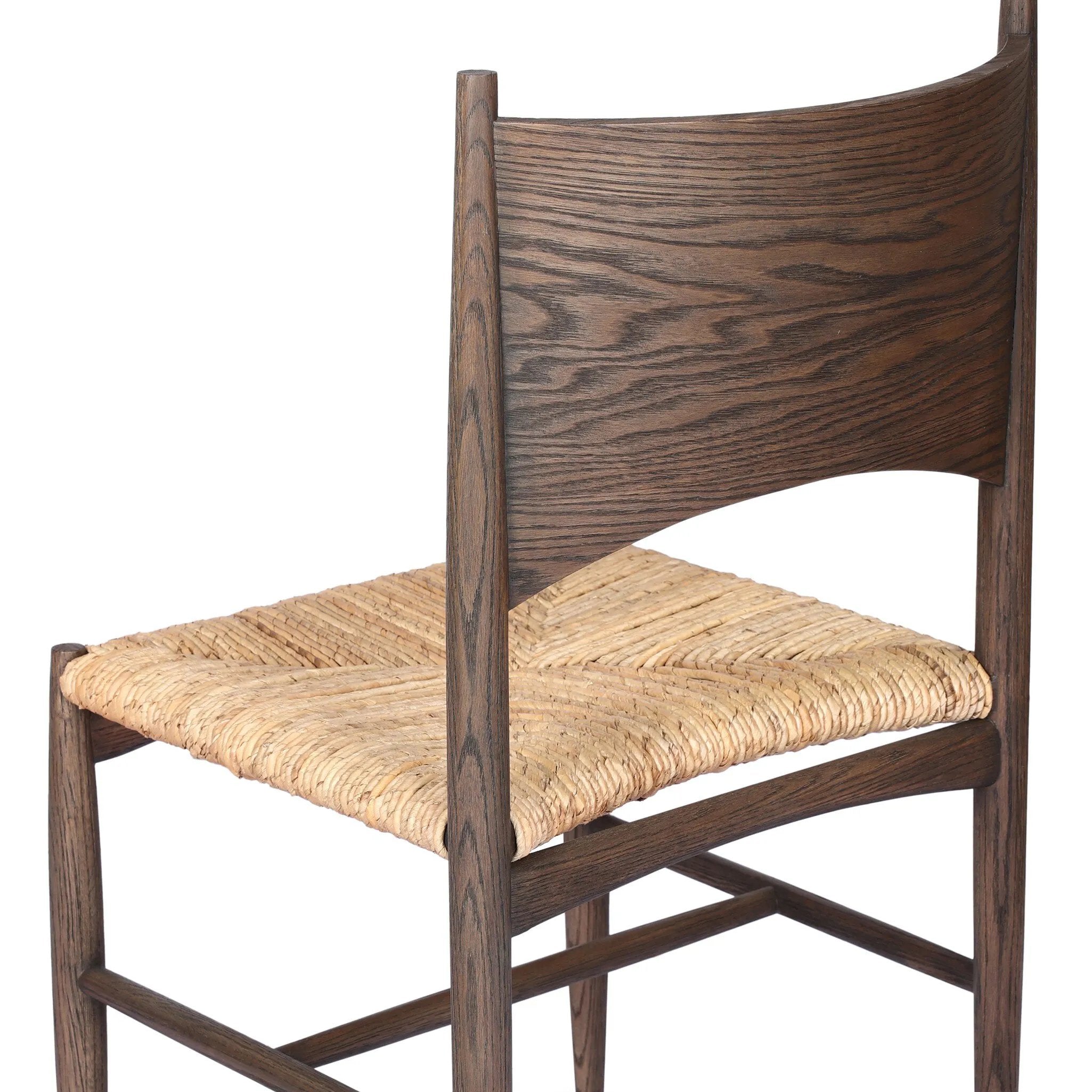 A seamless addition to your dining collection, a slim-profile dining chair pairs a woven banana leaf seat with a solid oak frame featuring a bentwood back Amethyst Home provides interior design, new home construction design consulting, vintage area rugs, and lighting in the Laguna Beach metro area.