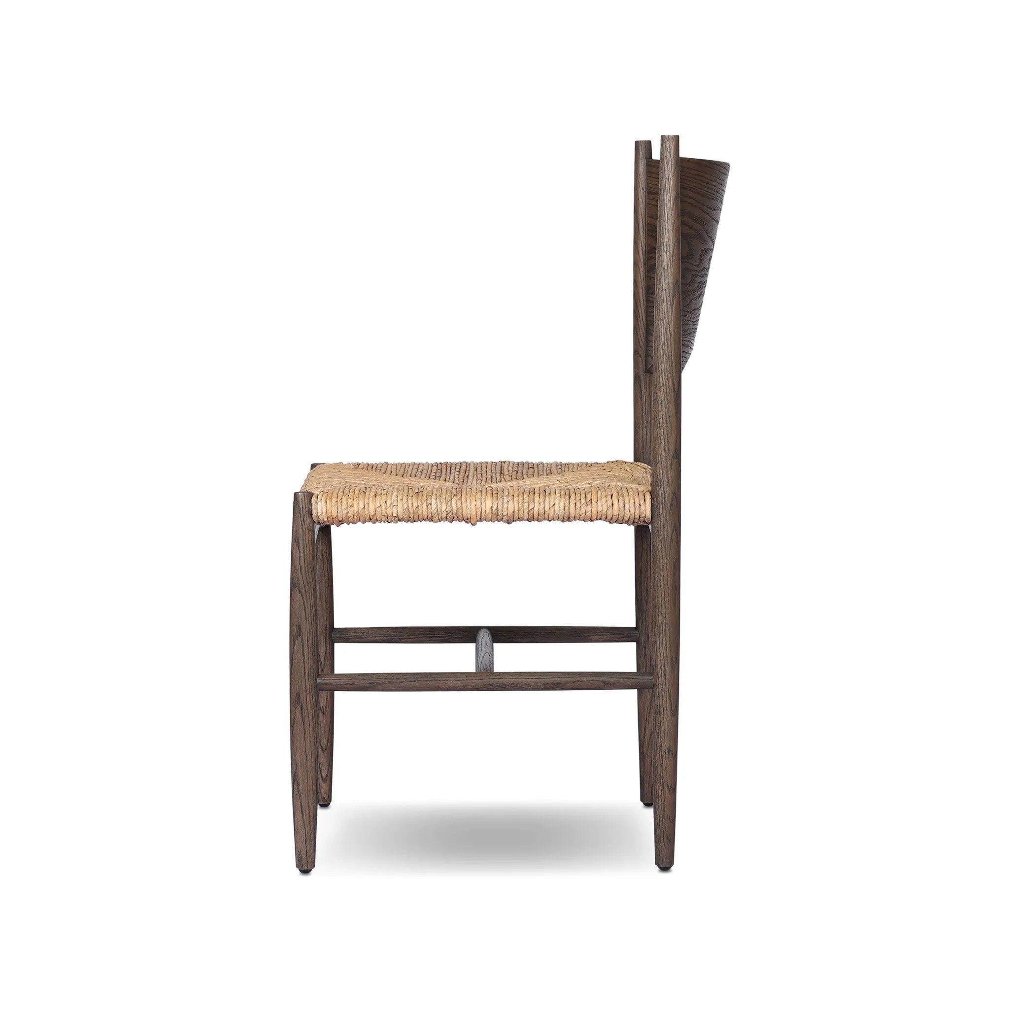 A seamless addition to your dining collection, a slim-profile dining chair pairs a woven banana leaf seat with a solid oak frame featuring a bentwood back Amethyst Home provides interior design, new home construction design consulting, vintage area rugs, and lighting in the Salt Lake City metro area.