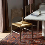 A seamless addition to your dining collection, a slim-profile dining chair pairs a woven banana leaf seat with a solid oak frame featuring a bentwood back Amethyst Home provides interior design, new home construction design consulting, vintage area rugs, and lighting in the Winter Garden metro area.