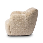 With a supple pile that's soft to the touch, taupe shearling upholstery pairs with an S-spring seat and enveloped frame for an inviting look and feel on this 360-degree swivel chair Amethyst Home provides interior design, new home construction design consulting, vintage area rugs, and lighting in the Alpharetta metro area.