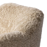 With a supple pile that's soft to the touch, taupe shearling upholstery pairs with an S-spring seat and enveloped frame for an inviting look and feel on this 360-degree swivel chair Amethyst Home provides interior design, new home construction design consulting, vintage area rugs, and lighting in the Miami metro area.