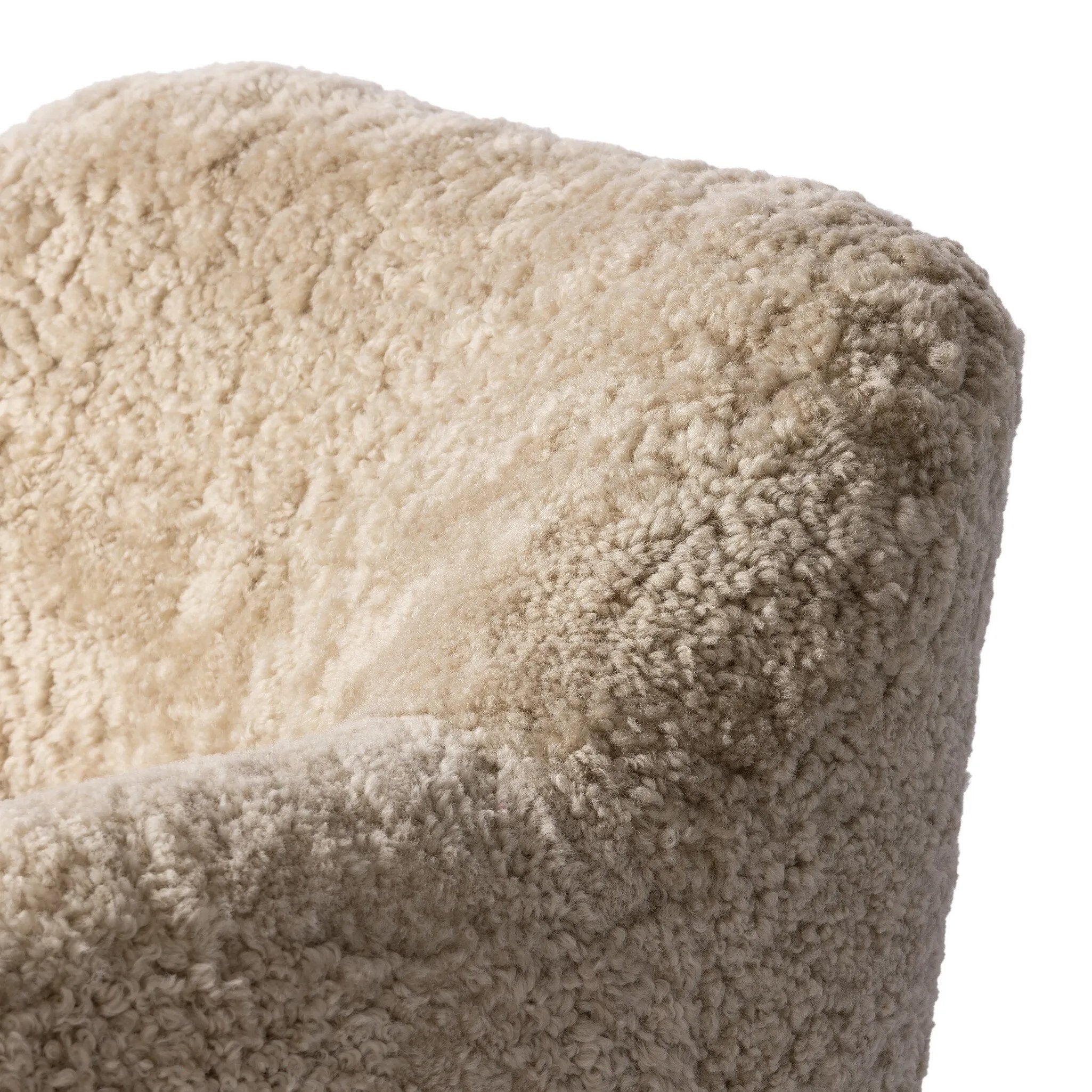With a supple pile that's soft to the touch, taupe shearling upholstery pairs with an S-spring seat and enveloped frame for an inviting look and feel on this 360-degree swivel chair Amethyst Home provides interior design, new home construction design consulting, vintage area rugs, and lighting in the Miami metro area.