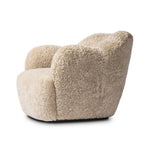 With a supple pile that's soft to the touch, taupe shearling upholstery pairs with an S-spring seat and enveloped frame for an inviting look and feel on this 360-degree swivel chair Amethyst Home provides interior design, new home construction design consulting, vintage area rugs, and lighting in the Monterey metro area.