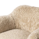 With a supple pile that's soft to the touch, taupe shearling upholstery pairs with an S-spring seat and enveloped frame for an inviting look and feel on this 360-degree swivel chair Amethyst Home provides interior design, new home construction design consulting, vintage area rugs, and lighting in the Newport Beach metro area.