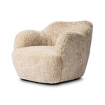 With a supple pile that's soft to the touch, taupe shearling upholstery pairs with an S-spring seat and enveloped frame for an inviting look and feel on this 360-degree swivel chair Amethyst Home provides interior design, new home construction design consulting, vintage area rugs, and lighting in the Portland metro area.