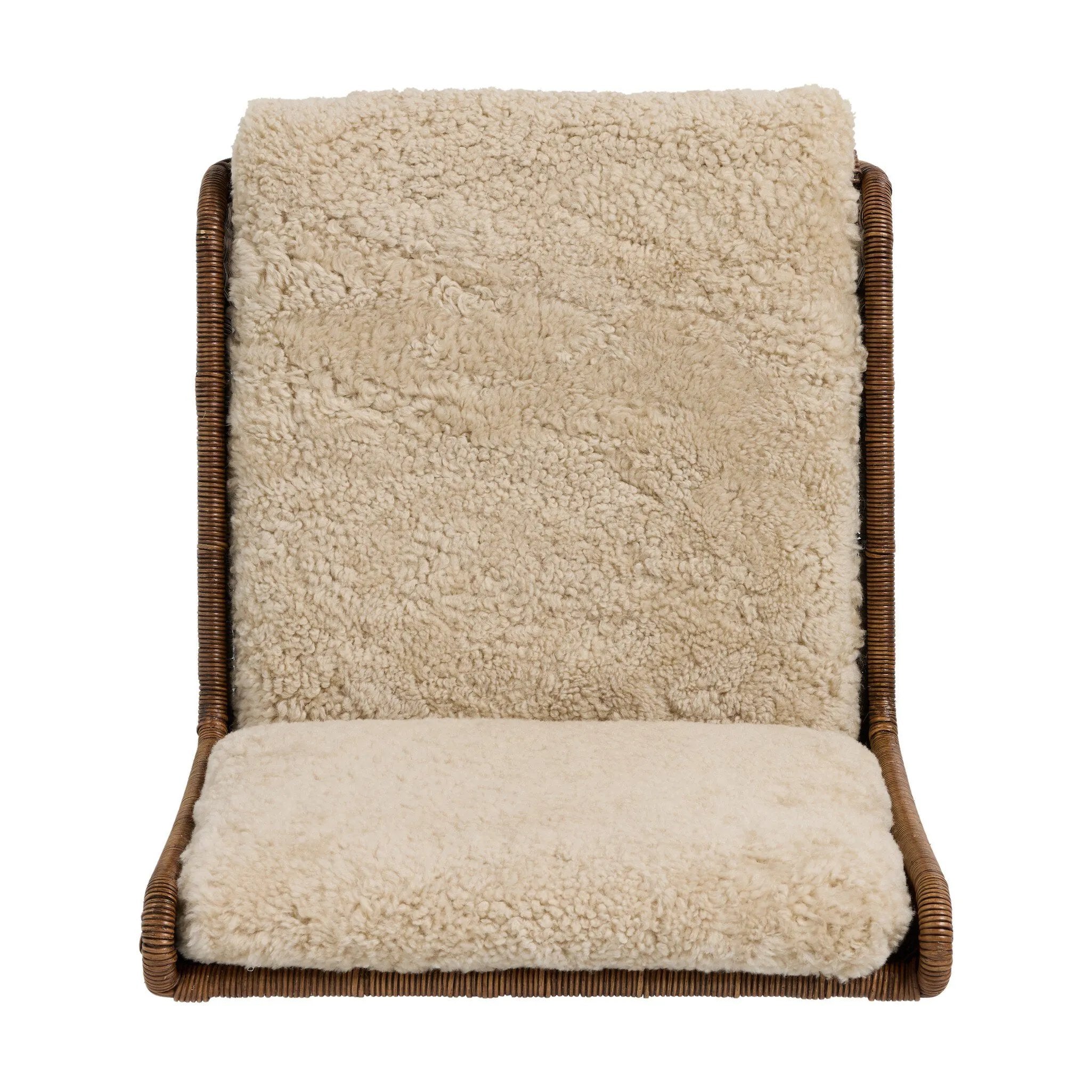 Contours and cantilevers define this Seventies-inspired dining chair. A woven sculptural frame of natural rattan bolsters textural shearling cushions for max comfort.As fans of wabi sabi materials at Amethyst, we love the warm modern inspired Katrine Dining Chair - Beige Shorn Shearling. Amethyst Home provides interior design, new home construction design consulting, vintage area rugs, and lighting in the Monterey metro area.